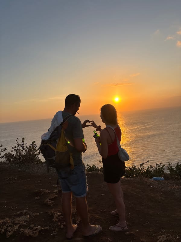 Sunset crowd gathers at Uluwatu cliffside viewpoint, Bali