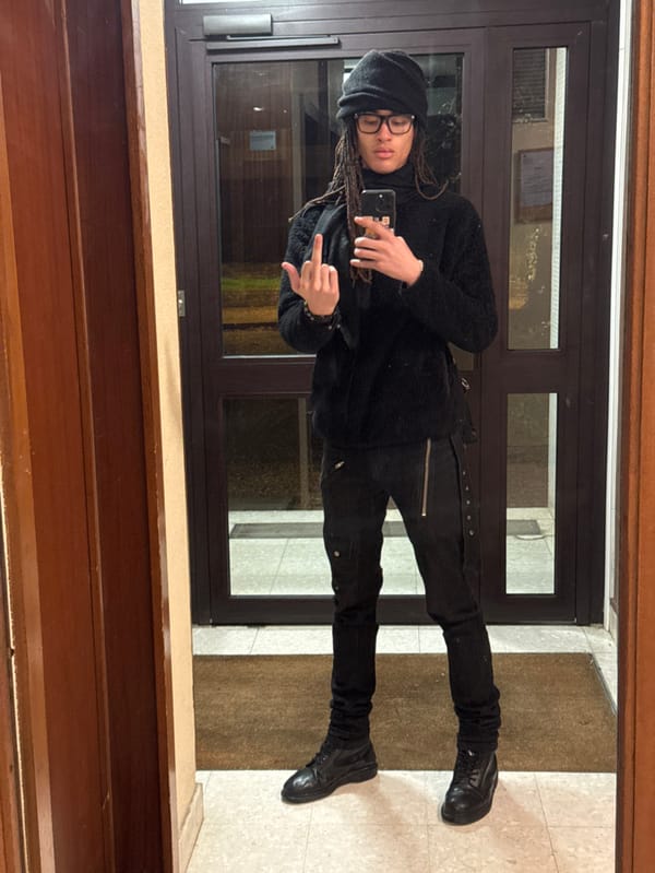 Person in black takes selfies in Les Ulis