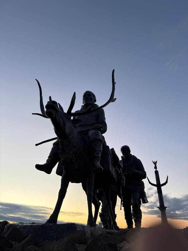Twilight tour of Mirny's public monuments, reindeer bronze to angel column