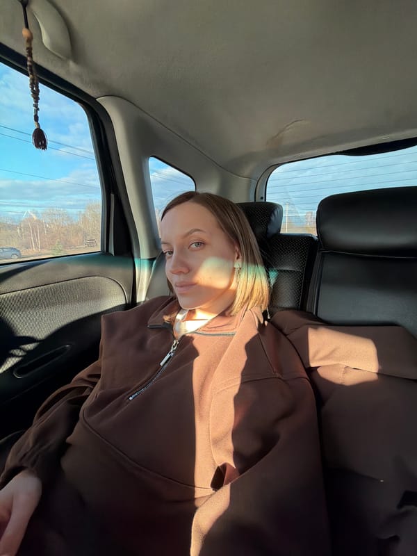 Person photographed in car backseat in Minino, Russia