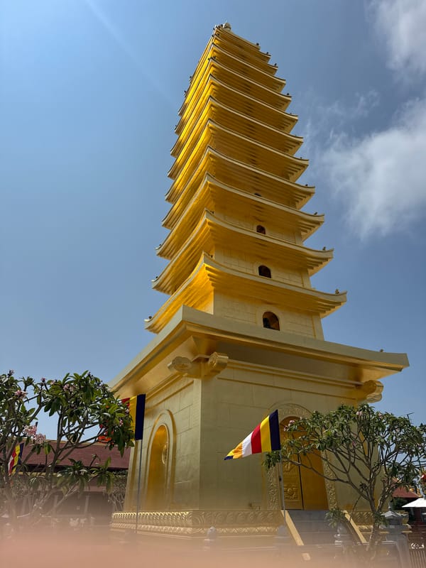 Golden pagoda and temple gate photographed in Diên Khánh