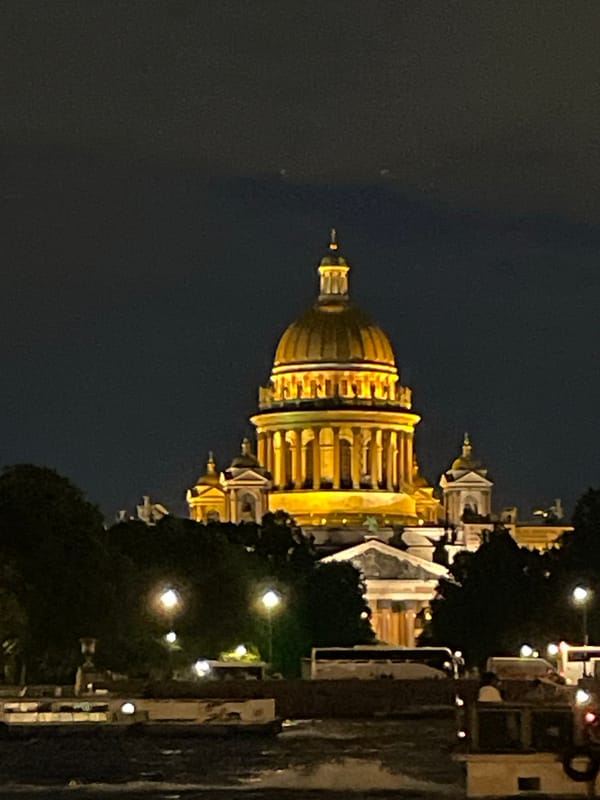 Saint Petersburg's golden landmarks illuminated along the Neva at night