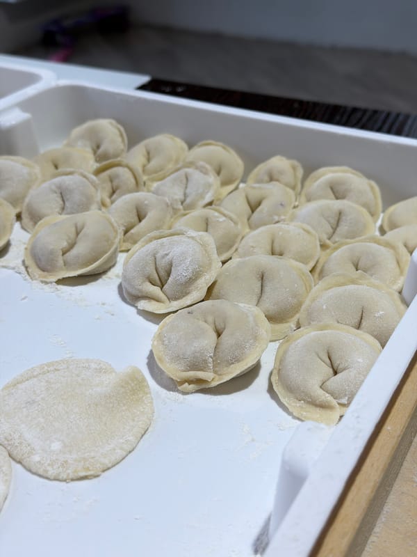 Woman makes homemade pelmeni dumplings in Chaikovsky, Russia