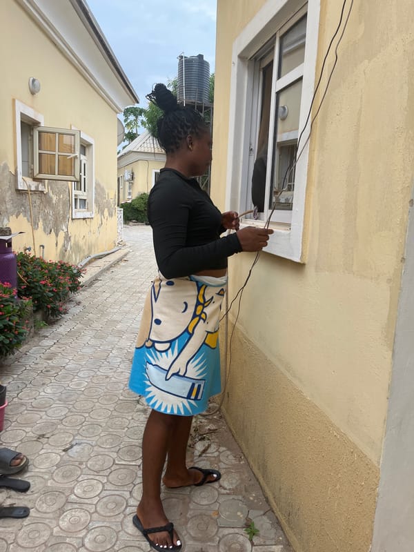 Daily life scenes from Abuja mixing indoor portraits and street cobbler work