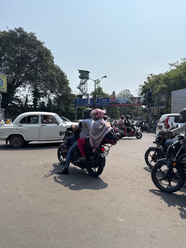 Motorcyclist observed during early morning traffic in Kolkata