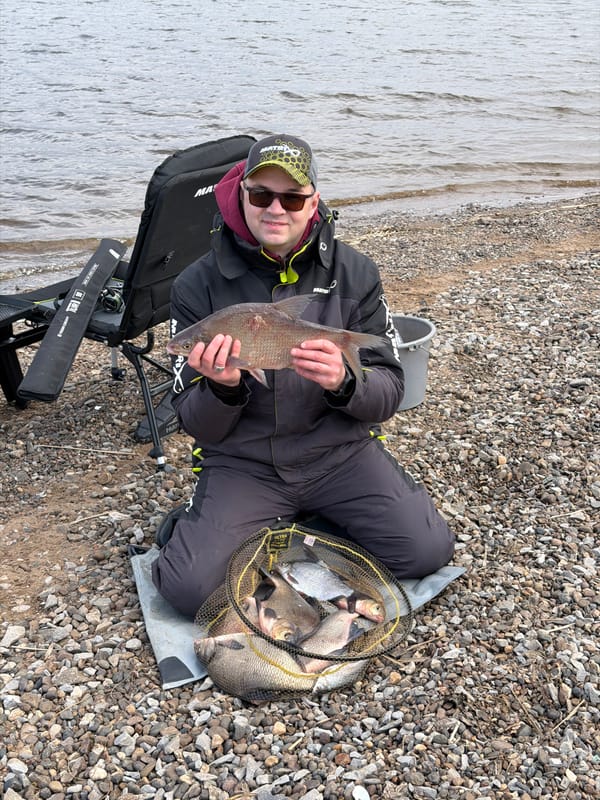 Man enjoys fishing outing on Chaykovsky shoreline