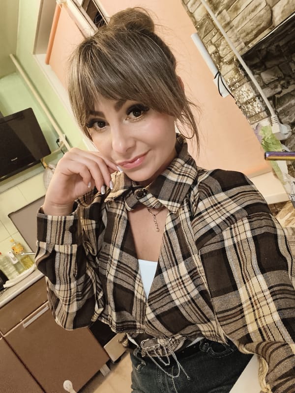 Woman and cat share quiet afternoon at home in Chaikovsky