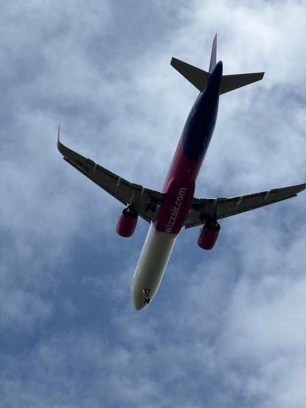 Overhead Wizz Air flight and damaged cars spotted in Burgas