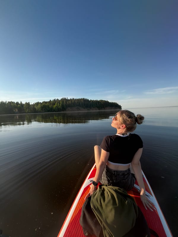 Couple enjoys afternoon paddleboarding session on Russian lake