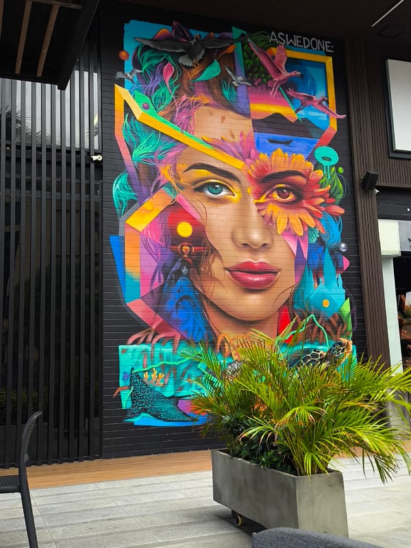 Outdoor dining area with mural documented in Pampatar, Venezuela
