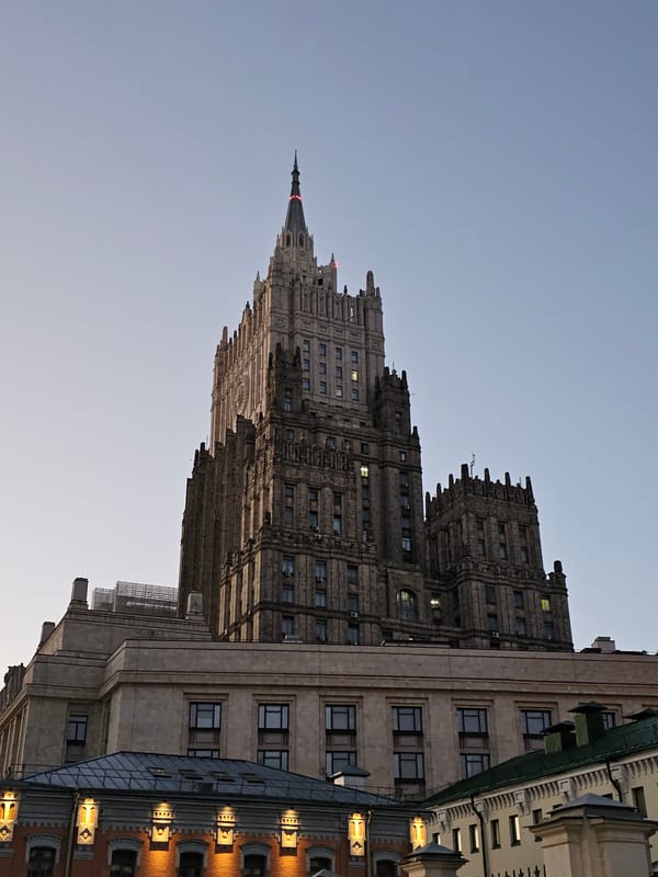 Moscow's Stalinist MFA tower at dusk, red star catching last light