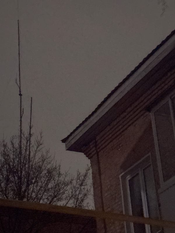 Nighttime photo captures brick building corner in Votkinsk, Russia