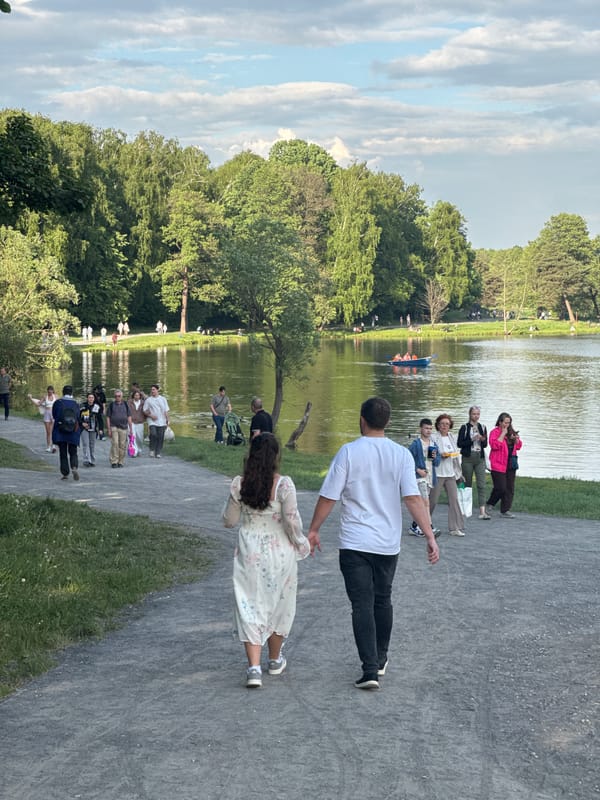 Afternoon park life unfolds around Moscow lake on May 24