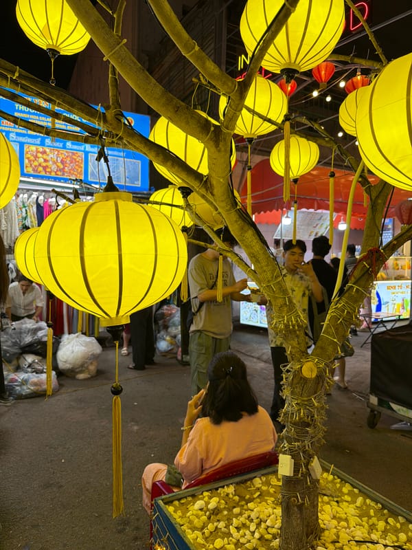 Nha Trang night market glowing under yellow lanterns
