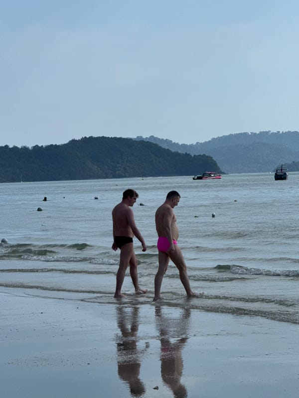 Tourists enjoy sunny morning activities at Malaysia's Cenang Beach