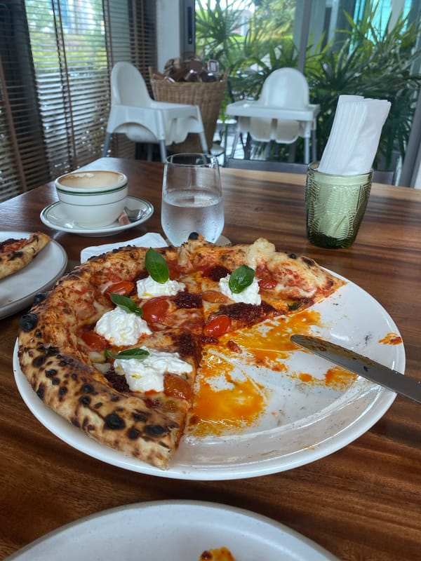 Morning pizza meal documented during rainy weather in Choeng Thale