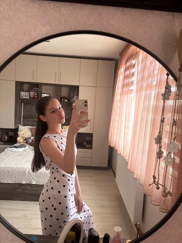 Woman takes series of mirror selfies in Bulgarian bedroom
