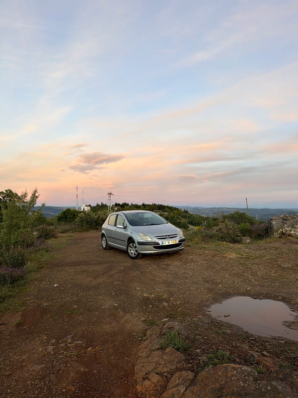 Silver Peugeot observed on dirt road during Bragança sunset