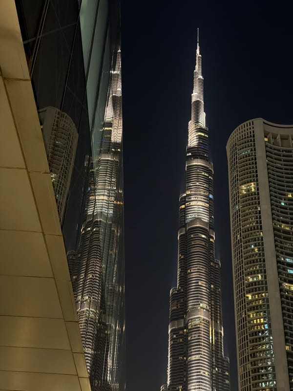Burj Khalifa reflection captured in Dubai glass surface