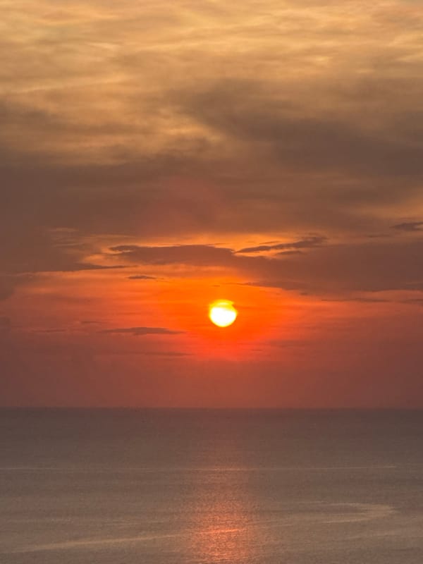 Sunset documented over Andaman Sea near Thai coastal village