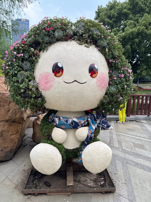 Garden scenes documented in Shanghai featuring sculptures and pond