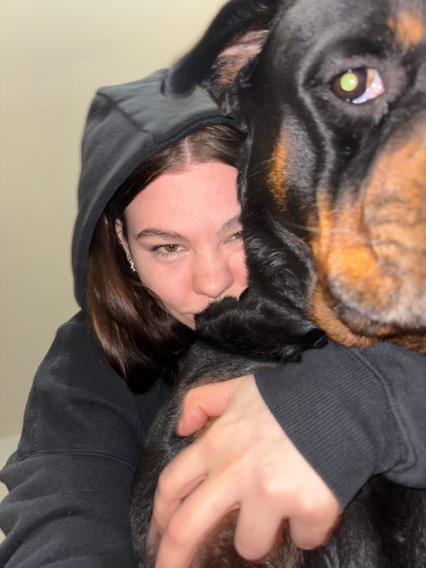 Person and large dog photographed together indoors in Perm