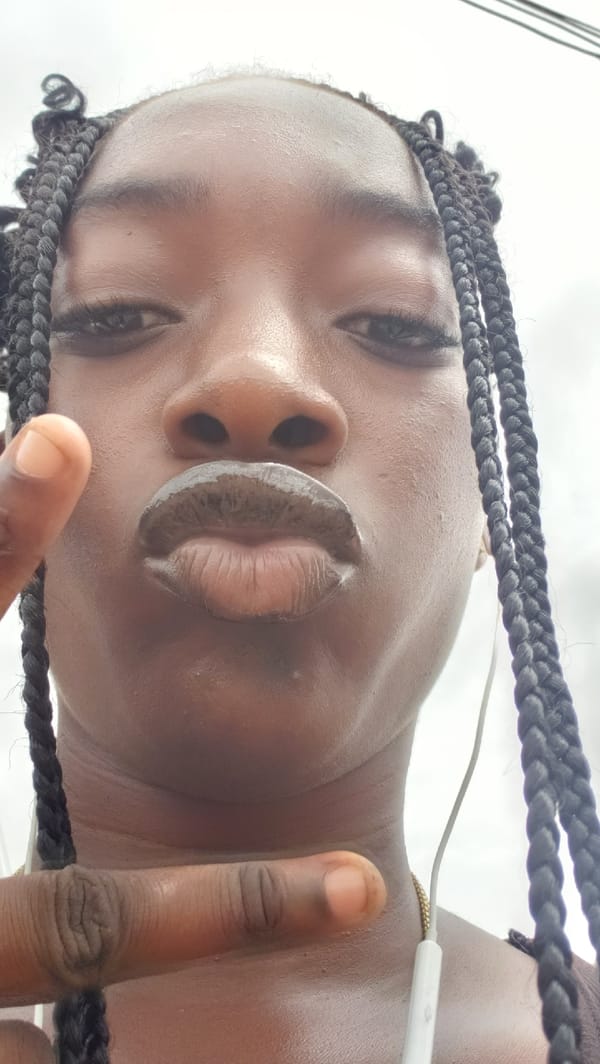 Woman takes selfie, street photos in Rido Nigeria
