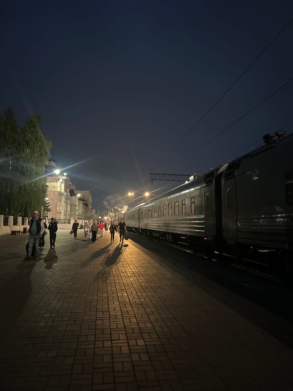 Nighttime scenes captured across Izhevsk showing cityscape and railway station