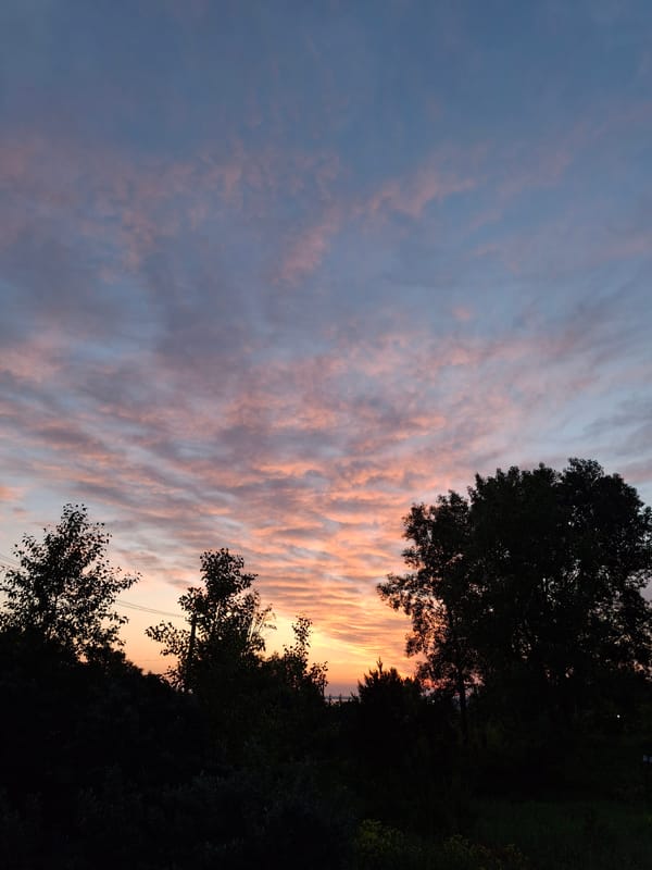 Vibrant sunset with rippling clouds observed over Chaikovsky, Russia