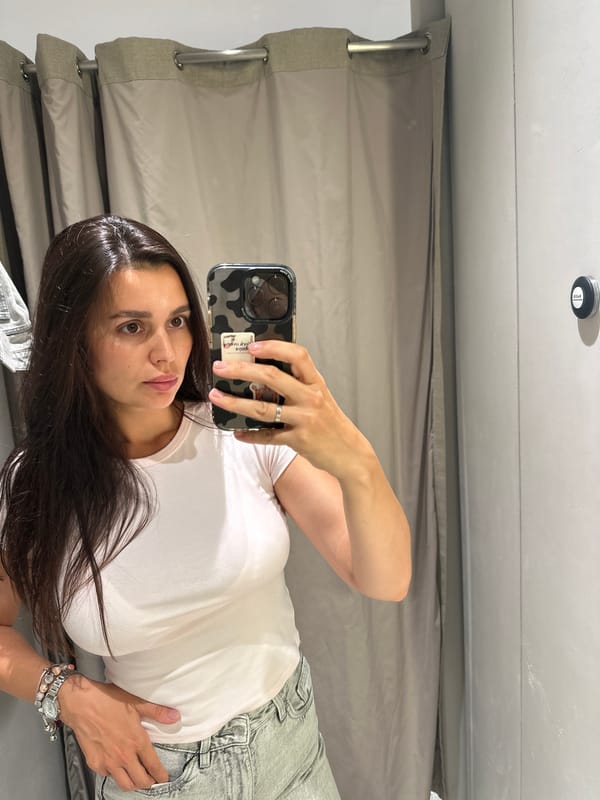 Fitting room mirror selfies during a shopping stop in Perm