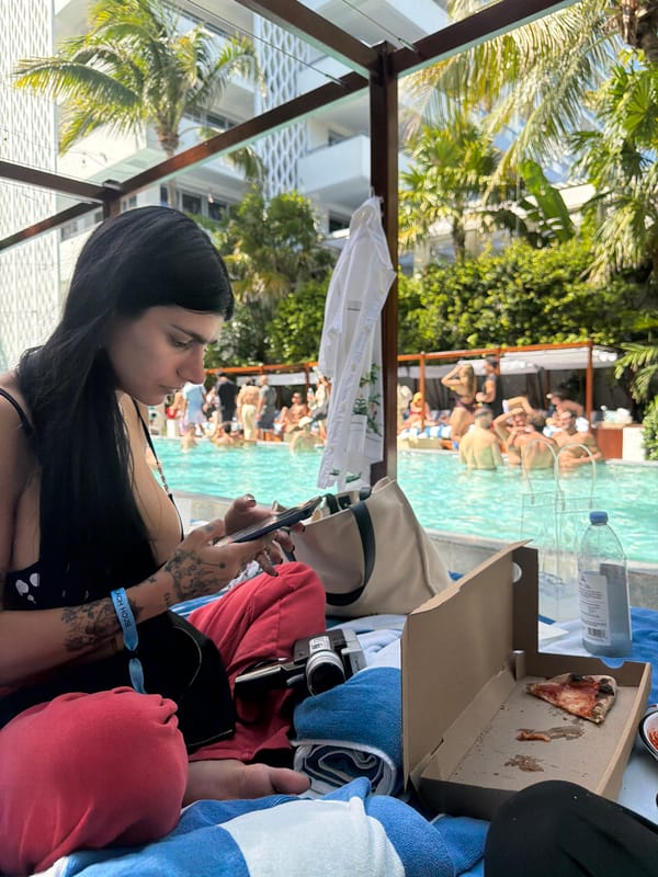Woman relaxes poolside in Miami Beach Saturday evening