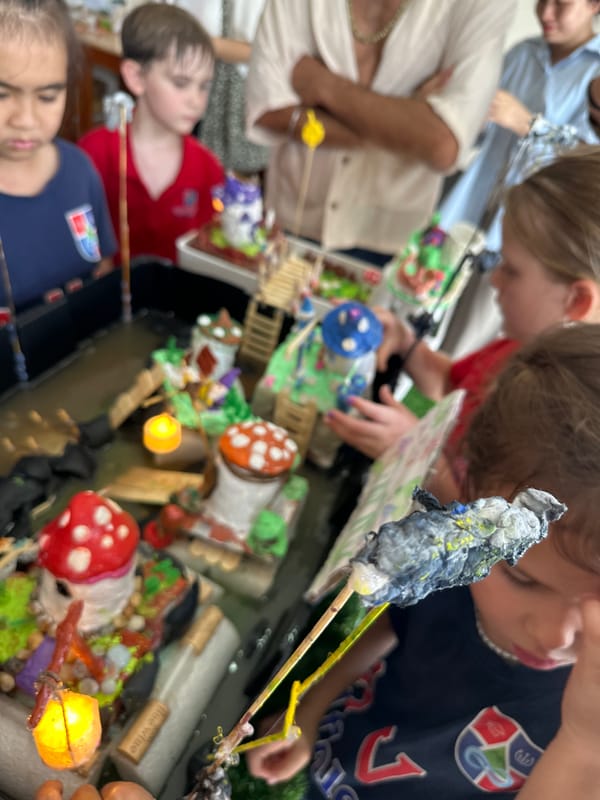 Kids showcase handmade gnome village dioramas at a Nha Trang school event