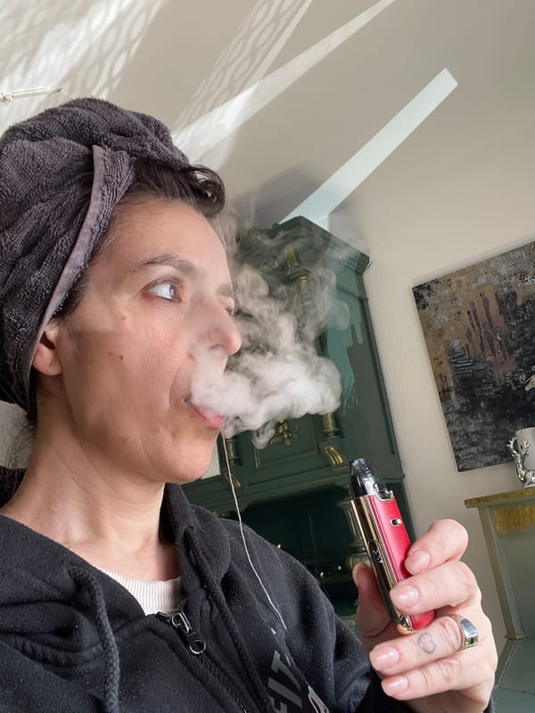 Woman vaping while resting in Konz, Germany