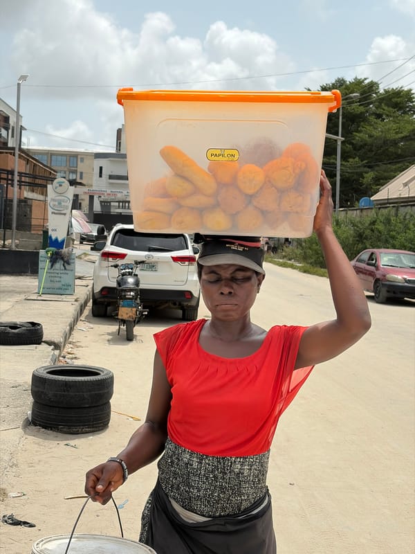 Street vendor, raised dump truck observed in Igboefon Nigeria