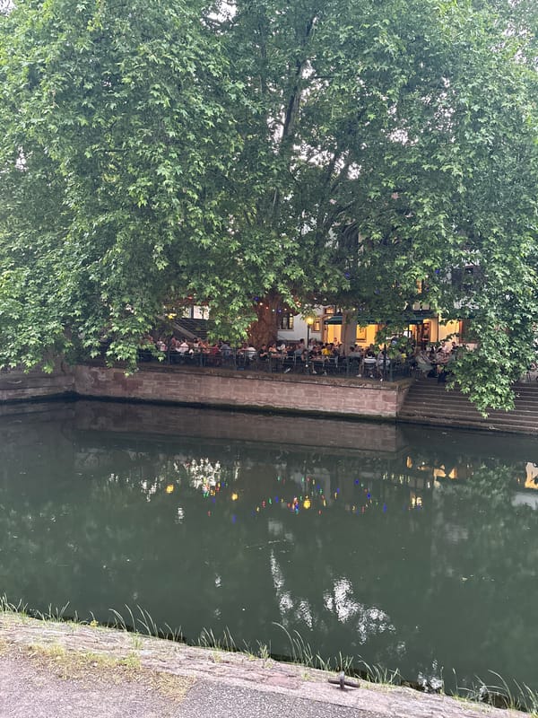 Evening diners gather at Strasbourg canal-side restaurant