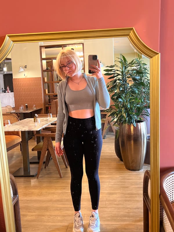 Woman takes mirror selfies with chihuahua at Montenegro cafe