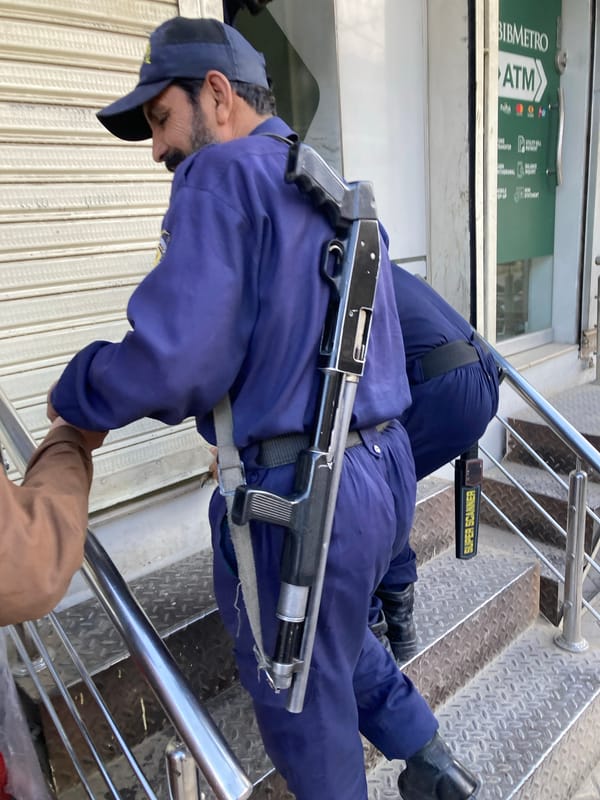 Armed security guard stationed at ATM location in Quetta