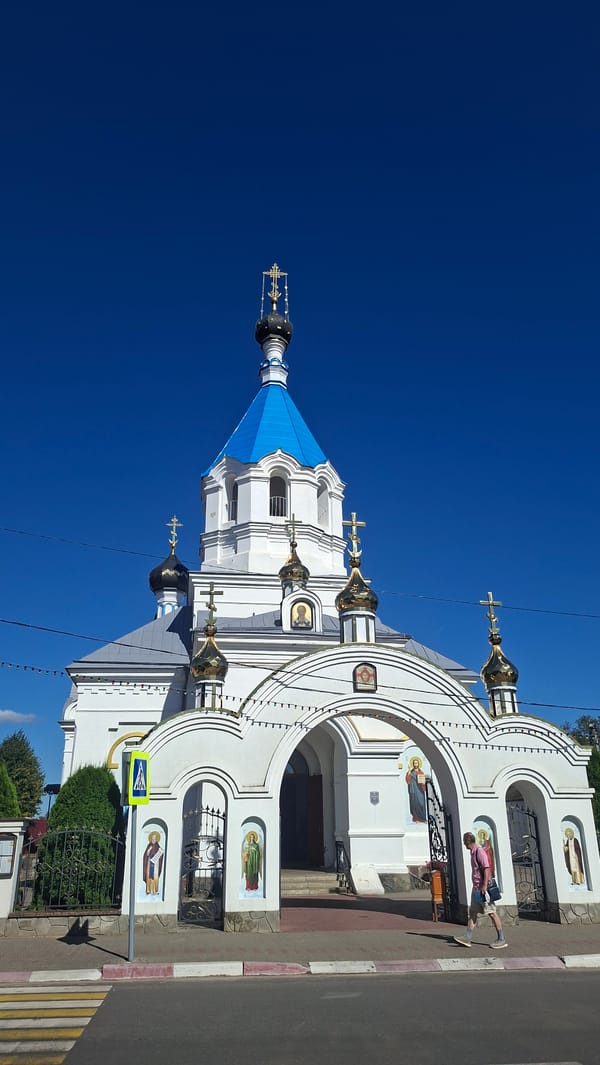 Sunny afternoon tour of Pastavy's churches, lake, and town landmarks