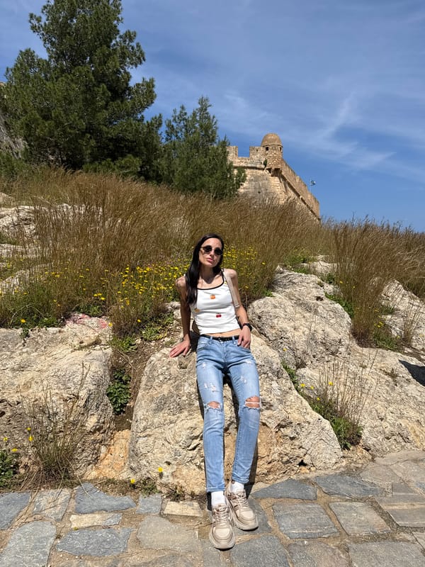 Woman photographed at multiple angles in historic Rethymno, Greece
