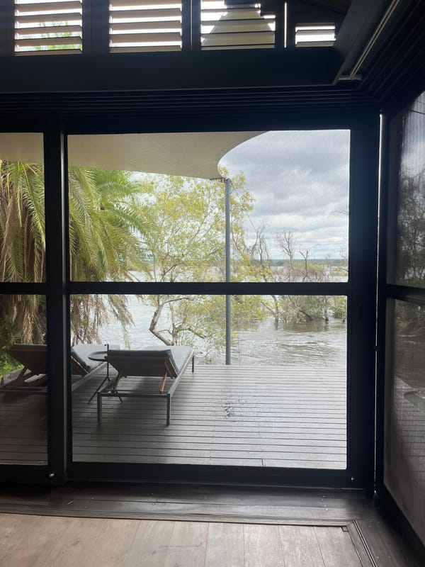 Tourist takes selfie in Livingstone accommodation overlooking water