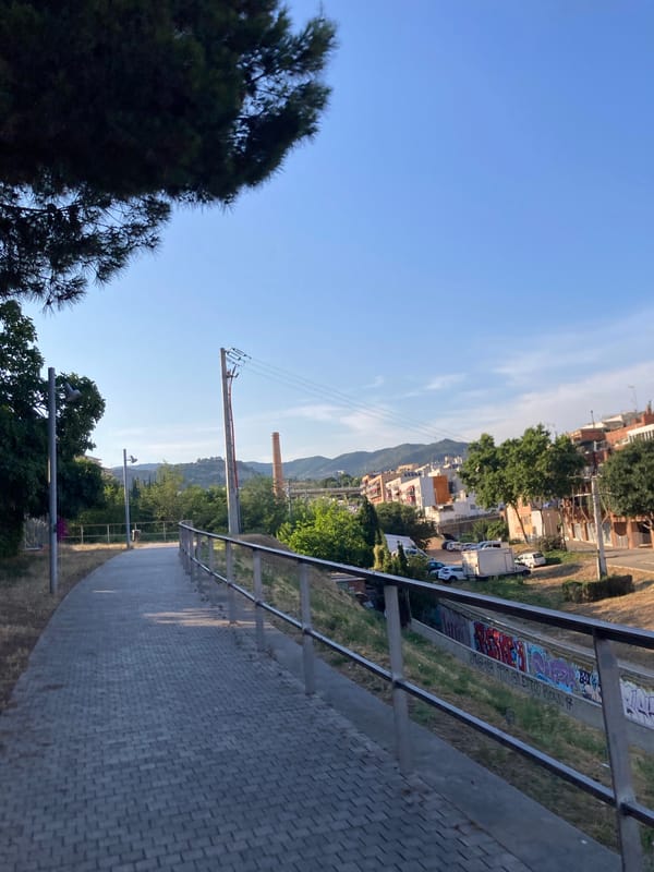 Graffiti-lined walkway in Badalona, street art on full display