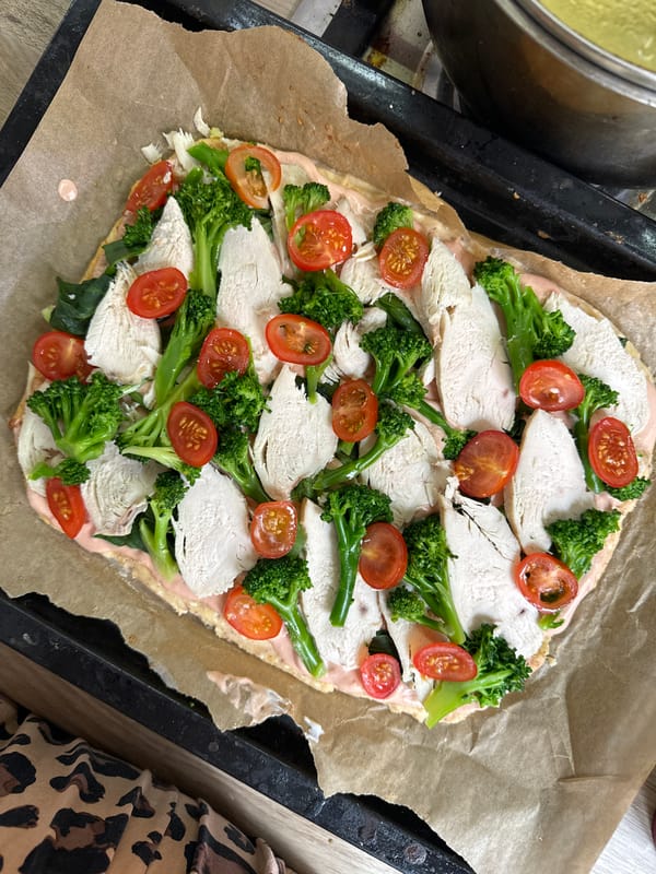 Home cook prepares chicken and vegetable pizza in Krasnoyarsk