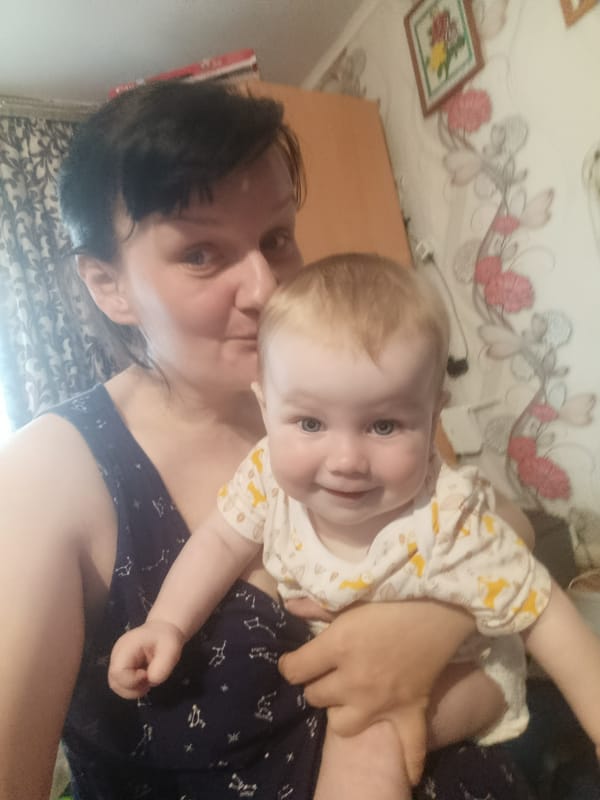 Woman and baby share intimate moment in Russian home
