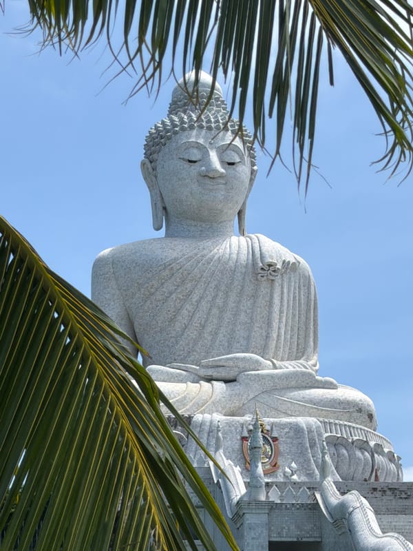 White Buddha statues overlooking Karon on a clear summer morning