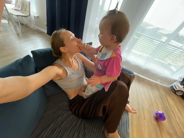 Casual home moments with a baby on a blue couch