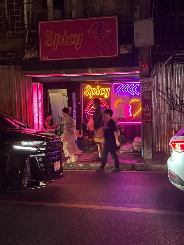 Bangkok nightlife commercial district captured during evening hours