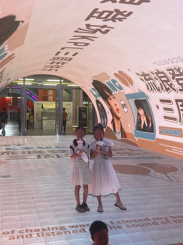 Jiefangbei CBD buzzes at night around Chongqing's clock tower