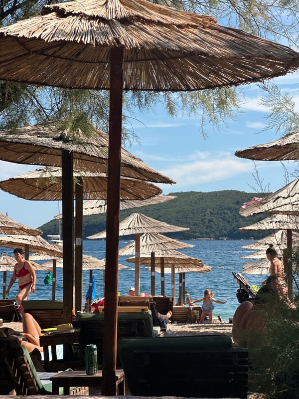 Budva's beaches and Adriatic waterfront on a busy summer afternoon