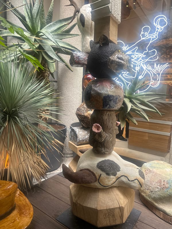 Art display with sculptures and plants spotted in Milan shop