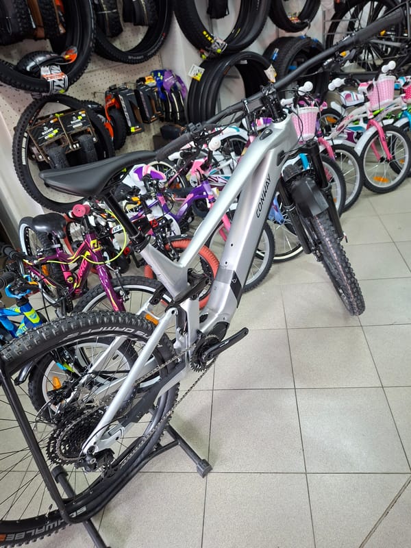 Morning scenes in Gabrovo: bicycle shop and sleeping cat